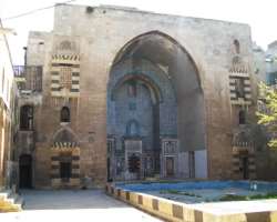 The historic buildings of the place include The Citadel, 12th-century Church-School named Al-Shibani, Sufi monastery named Khanqah al-Farafira, Al-Mat